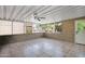 Enclosed sunroom with a ceiling fan, textured walls, and tile flooring for a relaxing space at 2400 E Baseline Ave # 228, Apache Junction, AZ 85119