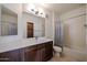 Bright bathroom features a modern vanity with white counters and a shower-tub combo at 2511 W Queen Creek Rd # 337, Chandler, AZ 85248