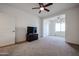 Bedroom with carpet, ceiling fan, television, access to another room, and a closet at 2511 W Queen Creek Rd # 337, Chandler, AZ 85248