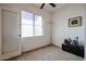 Bedroom featuring carpeted flooring, natural light, door to the hallway, and a chest of drawers at 2511 W Queen Creek Rd # 337, Chandler, AZ 85248