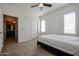 Bedroom featuring a bed, carpet, natural light, and access to the bathroom at 2511 W Queen Creek Rd # 337, Chandler, AZ 85248