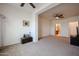 Bedroom with carpet, modern lighting, and access to the bathroom and connected room at 2511 W Queen Creek Rd # 337, Chandler, AZ 85248