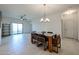 Open floor plan featuring a dining area and balcony access at 2511 W Queen Creek Rd # 337, Chandler, AZ 85248