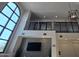 Bright lobby showcasing a modern chandelier, high ceilings, and a decorative tile accent wall with television at 2511 W Queen Creek Rd # 337, Chandler, AZ 85248