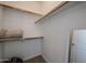 Spacious walk-in closet with shelving and hanging rods; perfect for organizing your wardrobe at 2511 W Queen Creek Rd # 337, Chandler, AZ 85248