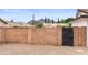 Enclosed backyard with block wall offers privacy and space for outdoor activities at 2614 E Mountain View Rd, Phoenix, AZ 85028