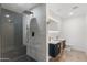 Modern bathroom featuring a glass enclosed shower and dual sink vanity at 2614 E Mountain View Rd, Phoenix, AZ 85028