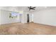 Generous room with plenty of light, wood flooring, and multiple access points at 2614 E Mountain View Rd, Phoenix, AZ 85028