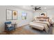 Bedroom with a ceiling fan, neutral decor, wood floors, and a view of the outside at 2614 E Mountain View Rd, Phoenix, AZ 85028