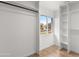A well-organized closet with built-in shelving and a window offering natural light and neighborhood views at 2614 E Mountain View Rd, Phoenix, AZ 85028