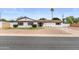 Charming single-story home with a well-maintained front yard and mature landscaping at 2614 E Mountain View Rd, Phoenix, AZ 85028