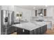 Bright modern kitchen with a large island, stainless steel appliances, and plenty of cabinet space at 2614 E Mountain View Rd, Phoenix, AZ 85028