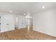 Spacious and bright living room with sleek wood flooring and neutral walls at 2614 E Mountain View Rd, Phoenix, AZ 85028