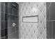 Modern shower with black fixtures and stylish patterned tiling at 2614 E Mountain View Rd, Phoenix, AZ 85028
