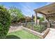 Beautiful backyard with a sparkling pool, a charming garden, and a covered patio for outdoor entertaining at 26271 N 46Th St, Phoenix, AZ 85050