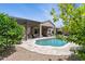 Expansive backyard featuring a pool, covered patio, lush greenery, and ample space for recreation at 26271 N 46Th St, Phoenix, AZ 85050