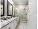 Bright bathroom features granite countertops, dual sinks, and a glass-enclosed walk-in shower at 26271 N 46Th St, Phoenix, AZ 85050