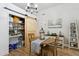 Charming dining area features a round table, slider pantry and decorative accents at 26271 N 46Th St, Phoenix, AZ 85050