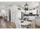 The dining area leads to a modern kitchen with stainless steel appliances and dark backsplash at 26271 N 46Th St, Phoenix, AZ 85050
