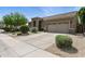 Lovely home with desert landscaping, a two-car garage, and a well-maintained lawn at 26271 N 46Th St, Phoenix, AZ 85050