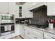 Modern kitchen features stainless steel appliances, granite countertops and a gas range at 26271 N 46Th St, Phoenix, AZ 85050