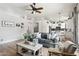 Spacious living area flowing into the kitchen, featuring modern design and ample natural light at 26271 N 46Th St, Phoenix, AZ 85050