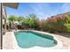 Lovely pool surrounded by colorful flowers and lush landscaping, creating a private oasis for relaxation and enjoyment at 26271 N 46Th St, Phoenix, AZ 85050