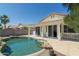A private backyard oasis featuring a refreshing pool with an attached covered patio at 2641 E Brooks St, Gilbert, AZ 85296
