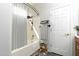 Bathroom featuring a shower over tub, towel rack, dark plank floors, and decor at 2641 E Brooks St, Gilbert, AZ 85296