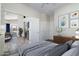 Relaxing bedroom with neutral tones, wood plank floors, and artwork at 2641 E Brooks St, Gilbert, AZ 85296