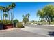 Greenfield Lakes Golf Clubhouse entrance view with mature palm trees at 2641 E Brooks St, Gilbert, AZ 85296