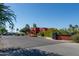 Exterior view of Greenfield Lakes Golf Clubhouse featuring lush landscaping at 2641 E Brooks St, Gilbert, AZ 85296