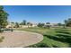 Enjoy a neighborhood park with shaded picnic tables, a volleyball court and playground on sunny day at 2641 E Brooks St, Gilbert, AZ 85296