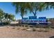 Neighborhood entrance sign with native trees and desert landscaping against a beautiful clear blue sky at 2641 E Brooks St, Gilbert, AZ 85296