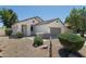 Charming single-Gathering home with desert landscaping, an attached garage, and a lovely front porch at 2641 E Brooks St, Gilbert, AZ 85296