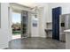 Bright kitchen with sleek stainless steel appliances and backyard views through sliding glass doors at 2641 E Brooks St, Gilbert, AZ 85296