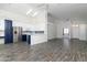 Open-concept living room showcasing a modern design with vaulted ceilings and seamless flow to kitchen at 2641 E Brooks St, Gilbert, AZ 85296