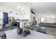 Bright living room featuring vaulted ceilings and seamless flow to the modern kitchen and dining area at 2641 E Brooks St, Gilbert, AZ 85296
