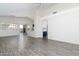 Bright living room with an open concept featuring natural light and vaulted ceilings at 2641 E Brooks St, Gilbert, AZ 85296