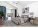 Bright main bedroom with sliding glass doors, vaulted ceilings, and neutral tones at 2641 E Brooks St, Gilbert, AZ 85296