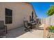 Backyard featuring a patio with comfortable outdoor furniture and a well-maintained landscape at 2839 S Copperwood --, Mesa, AZ 85212