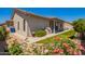Charming backyard featuring artificial grass, flower beds, a covered patio and desert-friendly landscaping at 2839 S Copperwood --, Mesa, AZ 85212