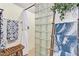 Bathroom with shower, glass block wall, decorative ladder and plush towels at 2839 S Copperwood --, Mesa, AZ 85212