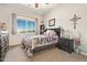 Bedroom with window view and dark wood furniture, creating a cozy and inviting space at 2839 S Copperwood --, Mesa, AZ 85212