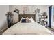 Bright bedroom with decorative pillows, stylish shelving, and unique wall art at 2839 S Copperwood --, Mesa, AZ 85212