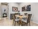 Cozy dining room with a round table, seating for four, and elegant wall decor at 2839 S Copperwood --, Mesa, AZ 85212
