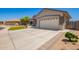 Well-maintained home with a spacious driveway and a two-car garage at 2839 S Copperwood --, Mesa, AZ 85212