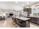 Open kitchen and living room with granite island, stainless steel appliances, and great natural light at 2839 S Copperwood --, Mesa, AZ 85212