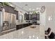 Modern kitchen with dark cabinets, granite countertops, and stainless steel appliances at 2839 S Copperwood --, Mesa, AZ 85212