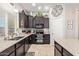 Well-appointed kitchen featuring dark cabinetry, stainless steel appliances, and stylish decor at 2839 S Copperwood --, Mesa, AZ 85212
